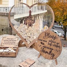 two heart shaped wooden plaques with words and hearts on them sitting next to each other