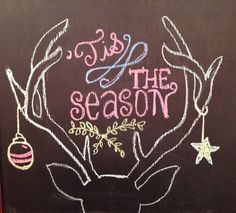 a chalkboard with the words tis, the season written on it