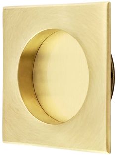 an image of a square brass knob on a white wall or door handle with a circular hole in the center