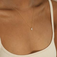 R A E ∙ D I A M O N D ∙ N E C K L A C E Classically elegant, the Rae Diamond necklace features a stunning teardrop-shaped diamond, strung along a thin, delicate chain. Its dainty pear diamond will be sure to attract many admirers from left, right, and center. Make it your trademark staple to add instant richness to any of your day-to-night looks. * Material: High Quality Solid 925 Sterling Silver * Finish: Sterling Silver ∙ 18K Gold * Featuring a 6mm x 9mm Pear CZ Diamond Charm with adjustable c Pear Diamond Necklace, Teardrop Diamond Necklace, Necklace Minimalist Jewelry, Teardrop Diamond, Sideways Initial Necklace, Dainty Initial Necklace, Charm Necklaces, Diamond Charm, Teardrop Necklace