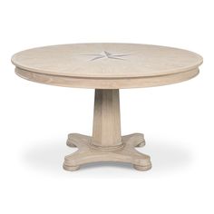 a white table with a star design on it's center and two leaves at the top