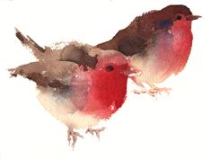 two birds sitting on top of a piece of paper