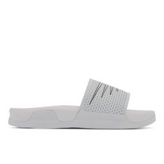 PRICES MAY VARY. Soft PU midsole Synthetic/textile upper Slip-on sandal for easy wear White Slides With Ortholite Insole For Summer, Synthetic Sport Sandals With Textured Sole, Flat Sport Sandals With Textured Sole, Sports Sandals With Textured Sole And Synthetic Material, Synthetic Sandals With Textured Sole For Sports, Sports Sandals With Textured Sole, White Synthetic Slides With Ortholite Insole, Sporty Synthetic Sandals With Textured Sole, Flat Synthetic Sport Sandals With Textured Footbed