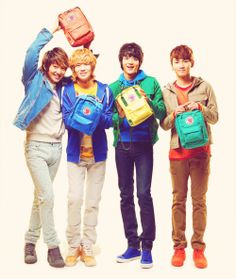 four young people with backpacks standing together