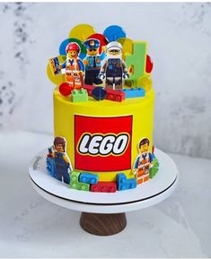 a lego cake is shown on a plate with the top tier decorated in legos