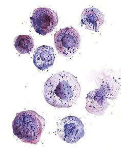 some blue and purple things on a white surface with watercolor paint splatters