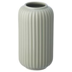 a large white vase sitting on top of a table