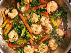 shrimp and vegetable stir fry in a wok on the stove