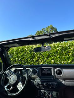 the interior of a car with its dashboard and dash board showing, it's sunroofing