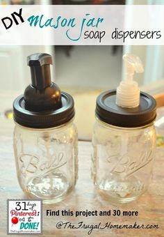 two mason jar soap dispensers sitting on a table