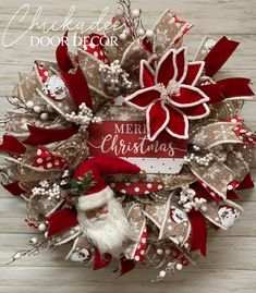 a christmas wreath with santa claus on it