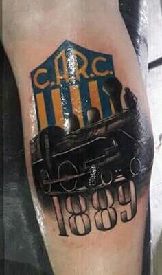 a man's leg with a train on it and the words circus written in black ink