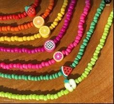 the beads are colorful and have fruit on them