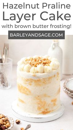 a cake with white frosting and walnuts on top is shown in front of the words, hazelnut pralie layer cake with brown butter frosting