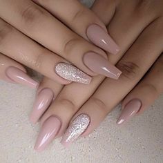 two hands with pink and white manies on their nails, one is holding the other's hand