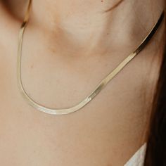 Meet the 4mm Hera, a sleek must-have that sits at your collarbone and shines in the sun unapologetically. Use this essential herringbone necklace as the base of your layers and have fun with it. Pair with two coins for a more boho look or with a paperclip chain if you’re feeling trendy. PRODUCT DETAILS Length: 17" + 3" Extention Thickness: 4mm Closure: Lobster Clasp Metal: 925 Sterling Silver Finish: Gold Vermeil Origin: Made in Italy Trendy Herringbone Necklace For Everyday, Dainty Herringbone Choker Necklace Gift, Trendy Herringbone Choker Necklace For Gifts, Minimalist Everyday Herringbone Choker Necklace, Dainty Herringbone Necklace With Adjustable Chain For Everyday, Dainty Herringbone Necklace For Everyday, Minimalist Herringbone Necklace For Everyday, Minimalist Everyday Herringbone Necklace, Everyday Minimalist Herringbone Necklace