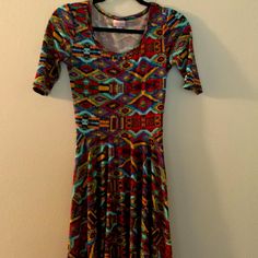 Multicolored A-Line Midi Dress; New Without Tags; Red, Blue, Yellow Patterned, See Pictures. Lularoe Nicole Dress, Size Xs. Great For Layering With A Cardigan And Boots! Half Sleeve, Scoop Neck, Full Skirt. Casual Fitted Midi Dress With Vibrant Print, Colorful Fitted Casual Midi Dress, Lularoe Nicole Dress, Aline Dress, Yellow Pattern, Aztec Print, Lularoe Dresses, Full Skirt, Half Sleeve