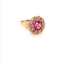 Vintage 1940's 10k yellow gold pink stone ring. The center stone is the color of a gorgeous pink sapphire. The size of the ring is a 5.75, and has the ability to be resized. Fine Jewelry Pink Cluster Ring With Accent Stones, Heirloom Pink Ring With Halo Setting, Pink Fine Jewelry Rings For Formal Occasions, Classic Pink Ruby Ring With Halo Setting, Pink Sapphire Ring With Halo Setting For Formal Occasions, Pink Gemstone Cluster Ring In Fine Jewelry Style, Classic Pink Diamond Ring, Classic Pink Gold Rings With Center Stone, Classic Pink Cluster Ring For Formal Occasions