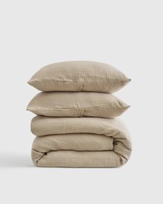 three pillows stacked on top of each other