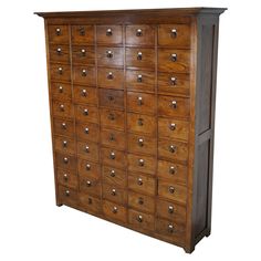 an old wooden cabinet with many drawers