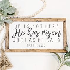 a wooden sign that says he is not here he has risen just as he said