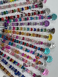 many different colored beads are arranged together