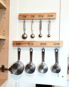 pots and pans are hanging on the wall