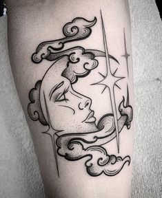 a black and white tattoo on the leg of a person with a sun behind her head