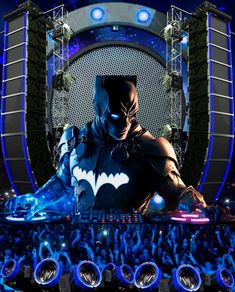 the dark knight rises in front of an audience at a concert with blue lights and sound equipment