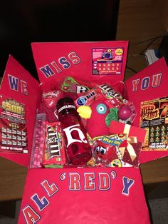 a red box filled with candy and candies