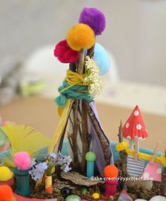 a close up of a cake made to look like a teepee tent with decorations on it