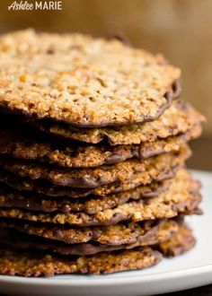 a stack of cookies sitting on top of a white plate