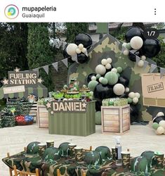 an army themed birthday party with balloons, decorations and table cloths on the tables