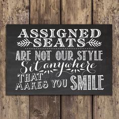 a chalkboard sign that says, assigned seats are not our style and another language that makes you smile