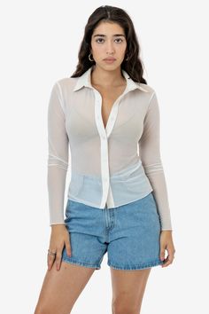 This slinky, long sleeve button up is made of our nylon micro mesh and features a tonal 100% cotton poplin collar for added structure. This shirt is finished with merrow hems at the sleeves and bottom hem for a feminine touch and has a mid-length fit perfect for any outfit. Try wearing this style tucked into high waisted styles, wearing it open with bralettes or bikini tops, or pair with our matching micro mesh styles. Our micro mesh fabric has 4-way stretch to accommodate a variety of sizes and Los Angeles Apparel, Mid Length Shorts, Mesh Shirt, High Waist Fashion, Mesh Long Sleeve, Sheer Blouse, Cute Tops, Cotton Poplin, Cotton Spandex