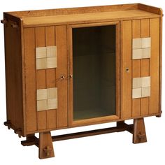 a wooden cabinet with two doors and three drawers on one side, the door is open