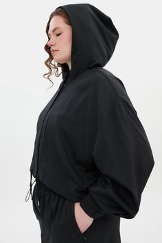 A boxy cropped windbreaker with a hood and adjustable ties. Cropped Windbreaker, Half Zip Windbreaker, Girlfriend Collective, Sport Bra Top, Racerback Bra, High Rise Leggings, Cropped Jacket, Sports Leggings, Crop Jacket