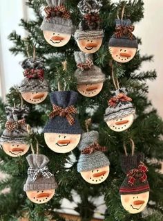 a christmas tree with snowmen hanging from it