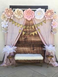 a decorated stage with flowers and bunting