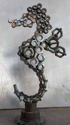 the sculpture is made out of metal parts