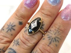 Vintage 10k gold oval onyx and diamond ring  Marquise cut onyx has been set into the 10k gold ring gold filigree work over the onyx has a diamond set into it  this ring is a size 6 the band at the back of the ring is 1.5mm the face of the ring is 18.3mm x 9.5mm weight of the ring is 2.61 grams onyx measures 14.8mm x7.1mm PLEASE BE ADVISED SOME PHOTOS ARE CLOSEUPS TO SHOW DETAIL, PLEASE READ FULL DESCRIPTION FOR BETTER UNDERSTANDING OF SIZE.  This item is preloved and Antique/Vintage. This means it may have signs of wear and use and is offered as is.  You will receive the exact item shown in the photos. There may be slight color variation depending on your monitor display. Please see pictures as they are part of the item description. Please contact me if you want more information and/or pic 10k Gold Ring, Ring Marquise, All Gems, Gold Filigree, Diamond Set, Marquise Cut, Ring Gold, 10k Gold, Rings Statement