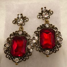 Antique Gold Look With Clear Stones Embellished Around A Red Stone That Is 1 Inch Long By 1/2 Inch Across Gold Jewlry, Red Gold Wedding, Ruby Earring, Red Jewel, My Shopping List, Red Gemstones, Clear Stone, Large Earrings, Red Stone