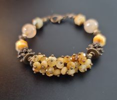 Handmade beaded cluster bracelet of natural faceted Gold Tiger's eye , genuine Rutilated quartz. Bronze accents.  Fits for 15.5-16.5cm wrist.  The bracelet comes in a gift box ready for gifting. You might also like earrings  https://www.etsy.com/uk/shop/LoveIuliia?ref=l2-about-shopname§ion_id=38529364 Not exactly what you are looking for? More of bracelets available here https://www.etsy.com/uk/shop/LoveIuliia?ref=l2-about-shopname§ion_id=38541683 Thank you so much for visiting my shop Iuliia xx Hand-strung Amber Bracelet Jewelry, Hand-strung Amber Bracelet, Agate Bracelet With Faceted Beads, Brown Faceted Bead Bracelet, Elegant Handmade Amber Beaded Bracelets, Amber Agate Bracelet, Artisan Bracelet With Faceted Beads, Yellow Faceted Beads Bracelet, Gold Bracelets With Faceted Beads