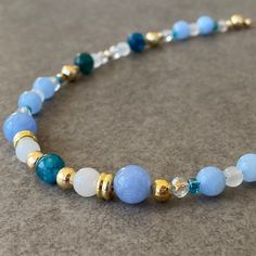 "Blue Apatite& Aquamarine & Moonstone & Quartz Bead Necklace ☆ Aquamarine and apatite are stone of courage.  Its calming energies reduce stress and quiet the mind.  Stones have an affinity with sensitive people.  They can invoke tolerance of others and overcomes judgmentalism, giving support to those overwhelmed by responsibility.  ☆ For the bracelet: https://www.etsy.com/listing/1472932795/blue-aquamarine-bracelet-men-blue ☆ Along with this necklace you have bought, an earring that matches its color is also a gift! ☆ Arrives ready for gifting and usually ships same day or next day. The necklace will be sent with a gift! O T H E R ∙ I N F O R M A T I O N Blue Apatite size: 5-6mm Blue Aquamarine size: 8 mm Moonstone size: 5-6 mm White Auqrtz size: 3-4 mm **Intermediate apparatus and beads a Blue Crystal Necklaces With Faceted Beads For Healing, Blue Faceted Bead Gemstones For Gifts, Blue Amazonite Beaded Necklace With Polished Beads, Blue Amazonite Round Bead Necklaces, Blue Faceted Beads Gemstones For Gifts, Blue Gemstone Beads As Gift, Blue Amazonite Polished Beads Necklace, Blue Crystal Necklaces With Gemstone Beads For Healing, Blue Gemstone Beads Crystal Necklace For Healing