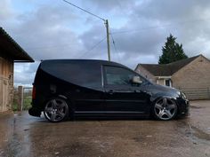 a black van parked in front of a house