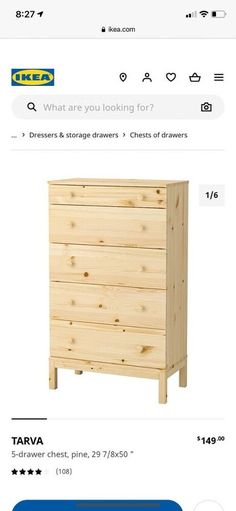 a wooden dresser sitting on top of a table next to an amazon listing page with the price