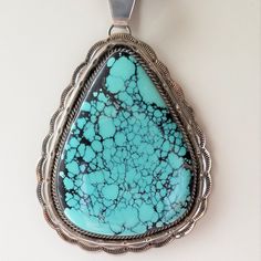 "This is an estate pendant sterling silver with stormy mountain turquoise. It is signed and tooled nicely. It weighs 92 grams. The pendant is 4 3/4\" including bail." Collectible Engraved Turquoise Necklace, Native American Fashion, Silver Work, Vintage Turquoise, American Jewelry, Turquoise Pendant, Photo Bracelet, Native American Jewelry, Pendant Necklaces