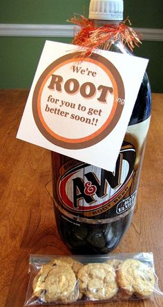 a bottle of root beer and cookies on a table