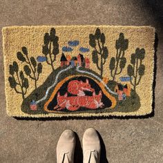 a woman standing in front of a door mat with her feet up on the ground