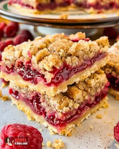 raspberry crumb bars stacked on top of each other